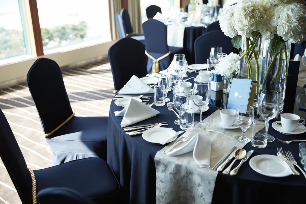 Grand Josun Busan Bagian luar foto A table set for a formal dinner
